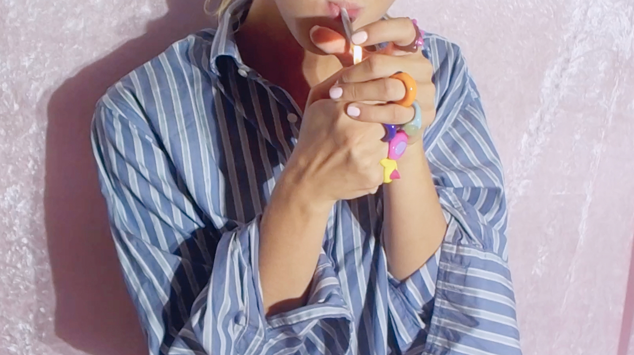 Colourful handmade rings worn on both hands